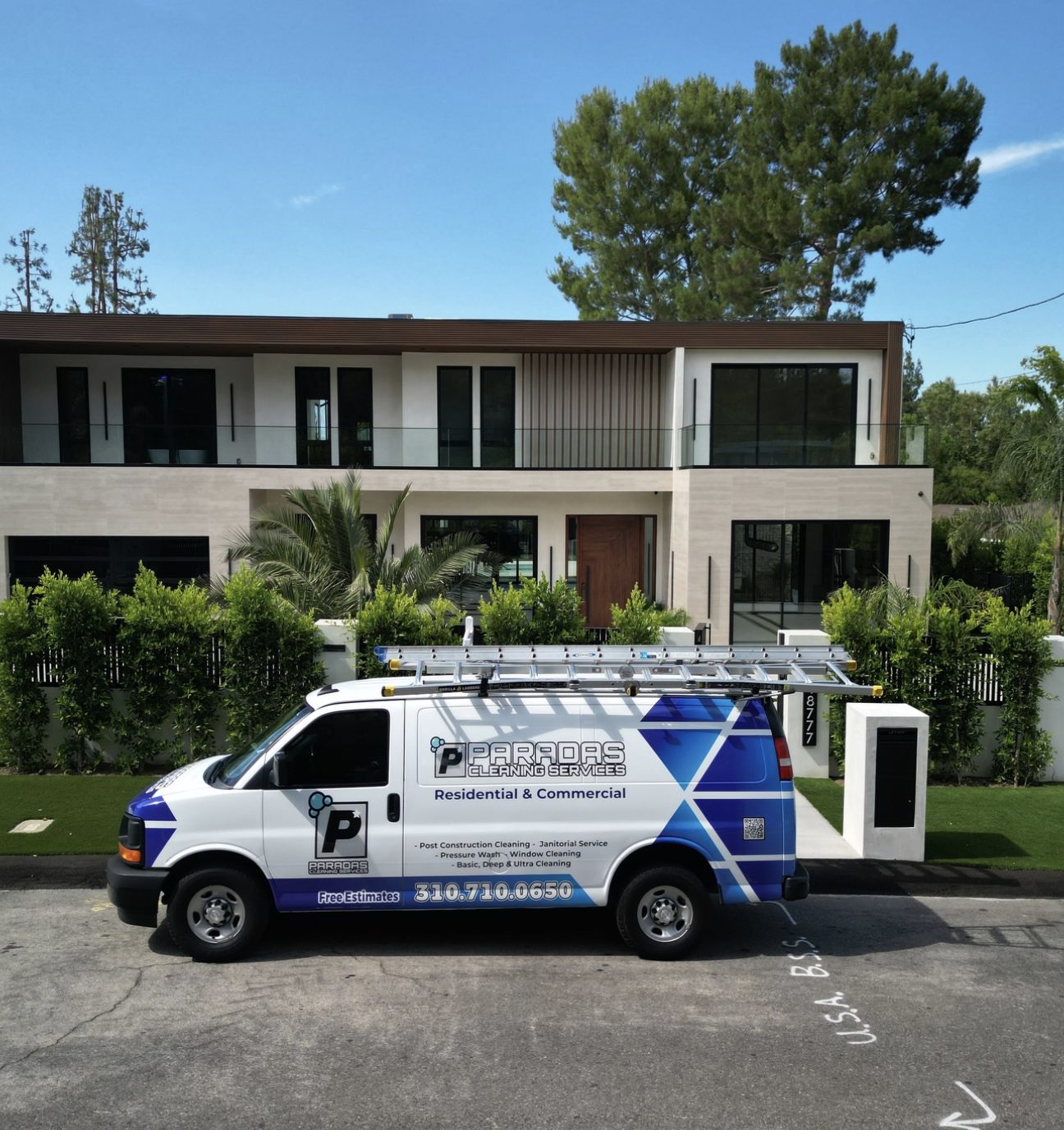 Paradas Cleaning Services van parked outside a modern Los Angeles home